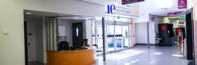 A shot of the YGK Airport’s main entrance, featuring a customer service desk on the left side of the door.