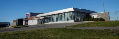 A wide-angle shot of the YGK Airport building taken from a distance.