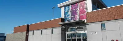 A close-up shot of the YGK Airport building taken from the front right side of the main entrance.
